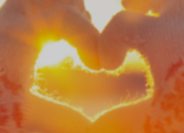 Girl in gloves making love symbol with hands