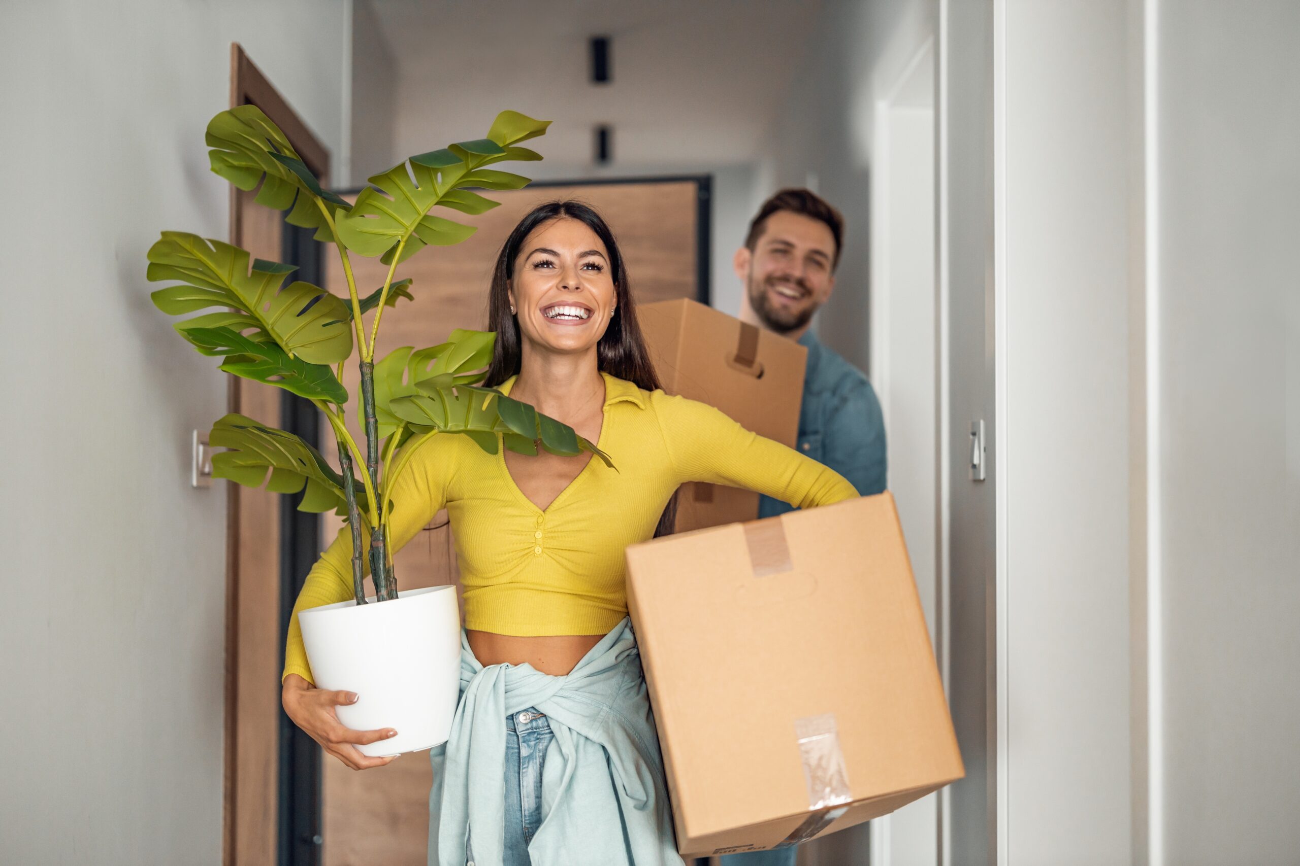 Young couple moving into home