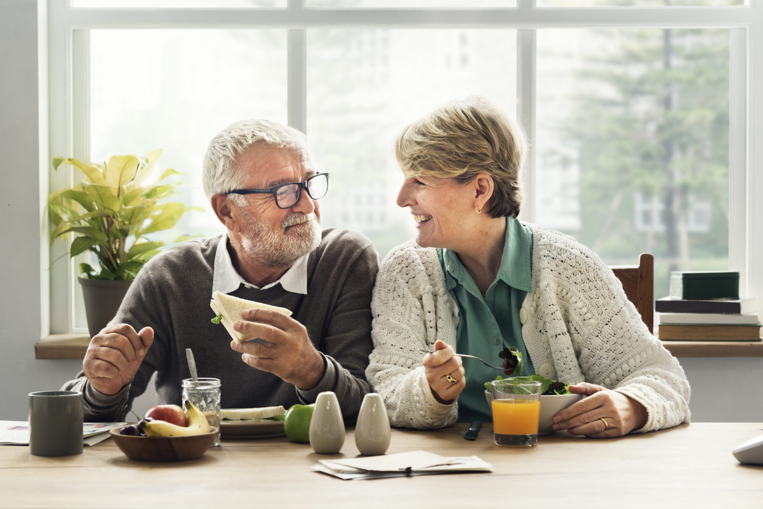 Retired couple eating breakfast