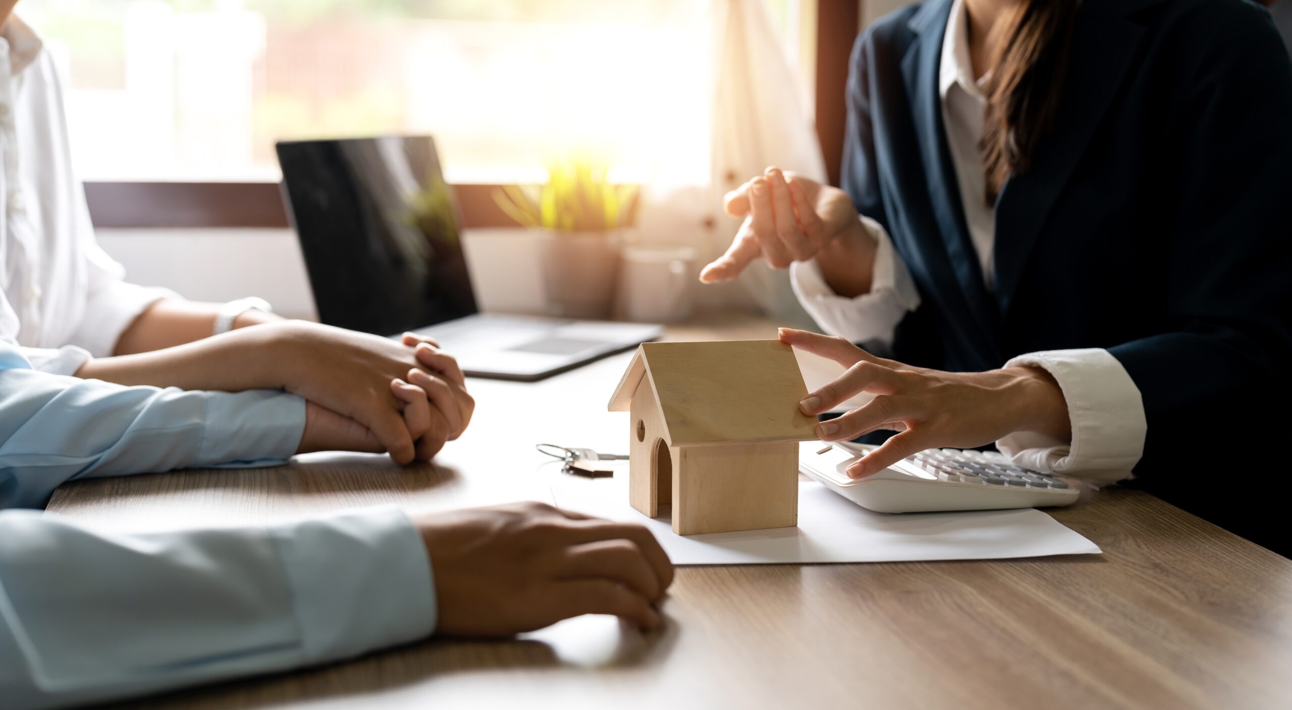 Couple talking to mortgage advisor