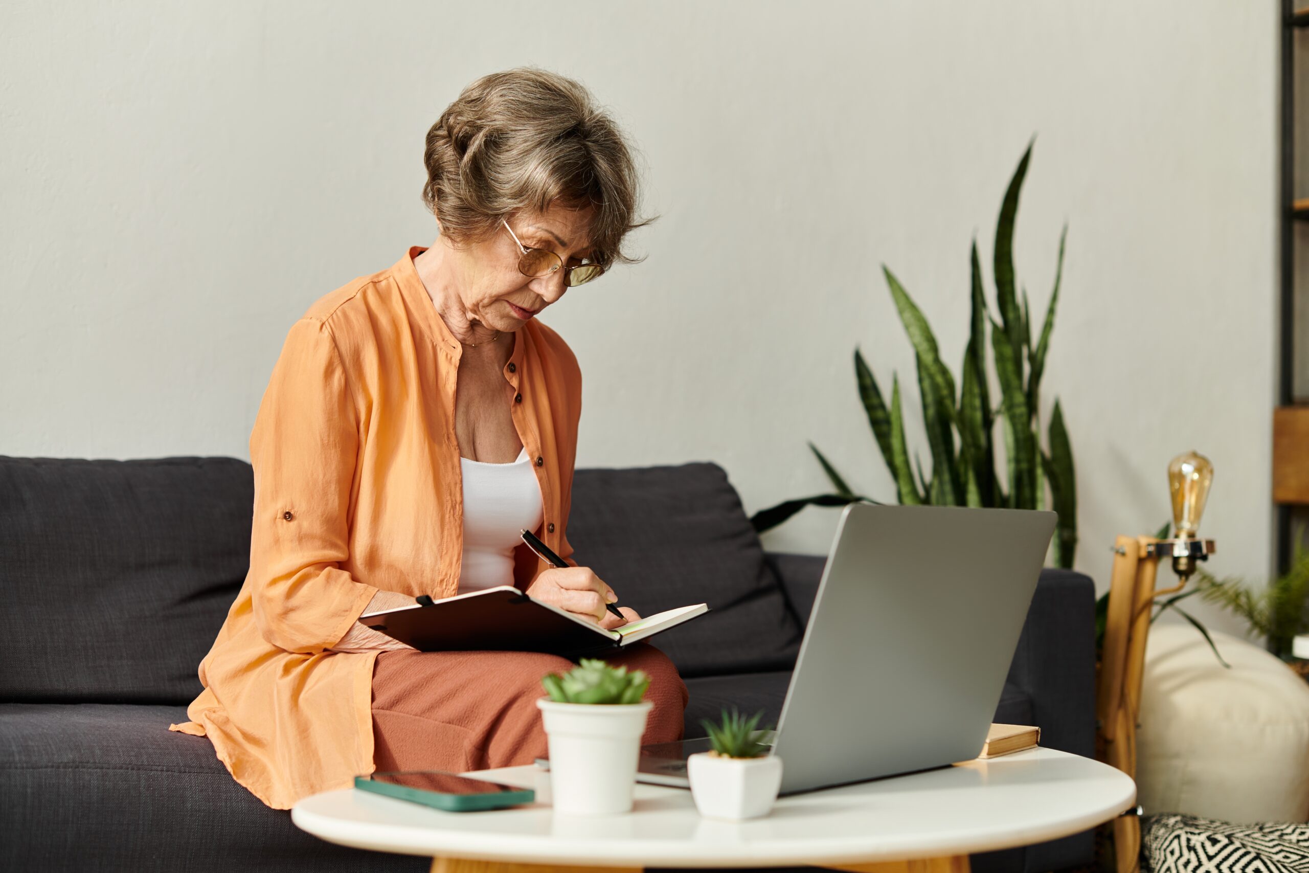 Woman writing into notebook